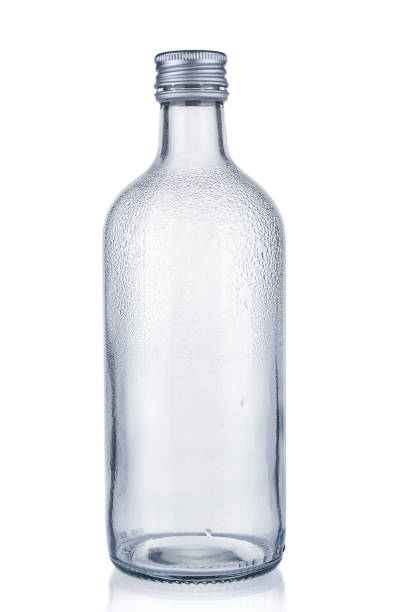 istock Empty glass bottle with water drops on white background 1206247915