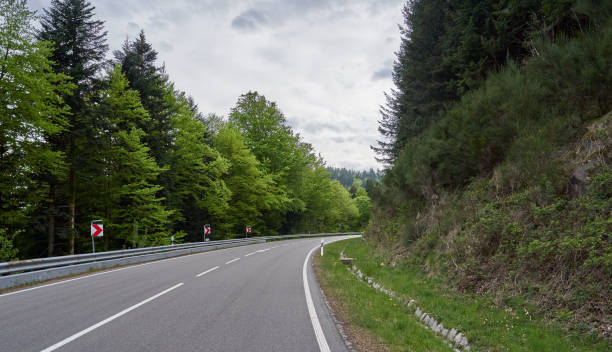 istock Beautiful asphalt road with turns through the Schwarzwald forest in Germany 1206248935