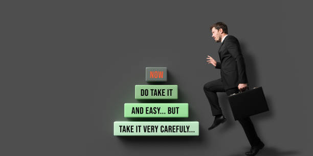 istock businessman climbing career letter step by step 1206249655