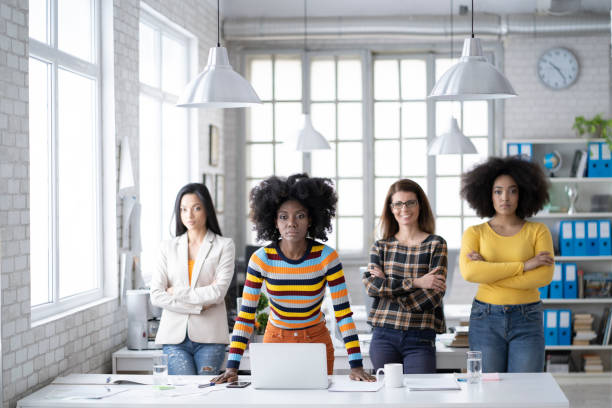 istock Succesuful female team standing in modern office 1206250023