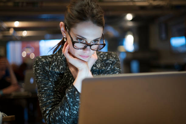 istock Cafe night woman laptop 1206251847