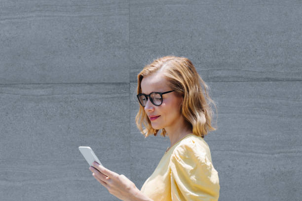 istock Businesswoman Using Cell Phone 1206258735