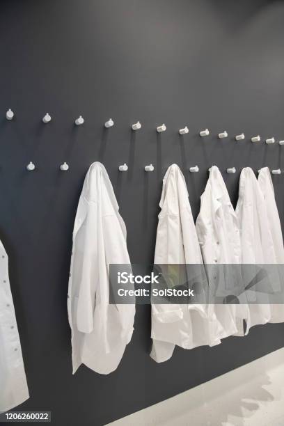 Medical Protective Clothing Stock Photo - Download Image Now - Lab Coat, Hanging, Coat Hook