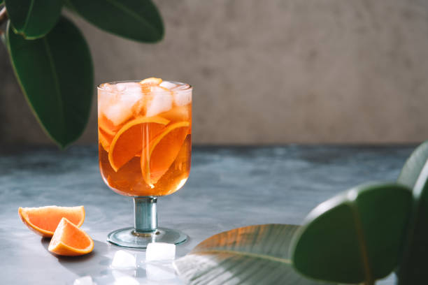 istock Spritz cocktail with oranges and ice in wine glass 1206262517