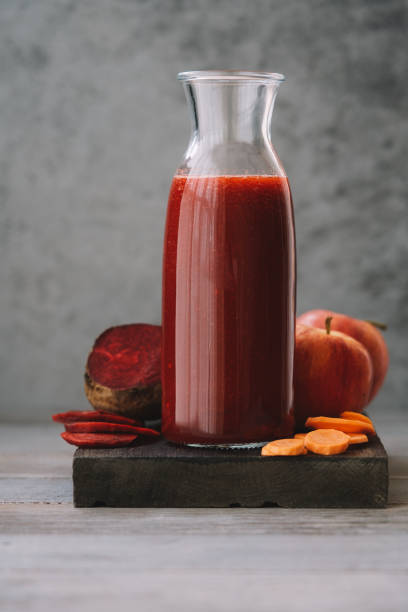 Beetroot smoothie with carrots and apple stock photo