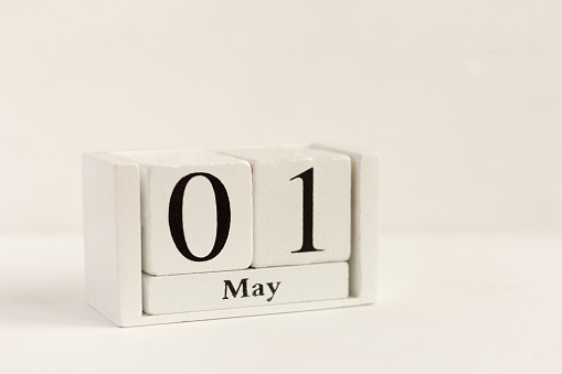 May 1 on the wooden calendar.The first day of the spring month, a calendar for the workplace. Spring. International workers ' solidarity day.