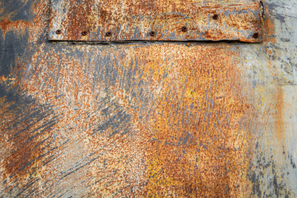 istock Rusty metal multicolor abstract outdoor wall with gray, white, and orange rust pattern 1206264473