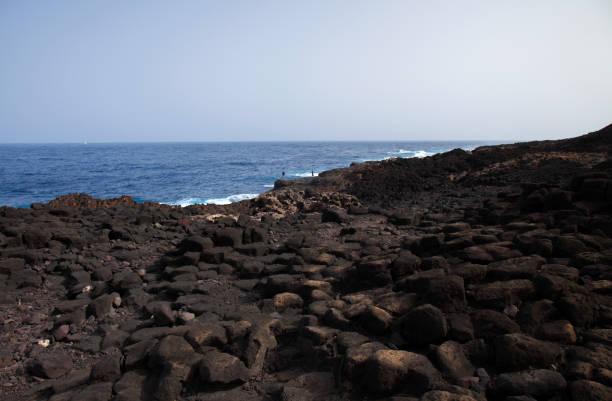 Gran Canaria, La Isleta peninsula, volcanic rock formations by the ocean shore