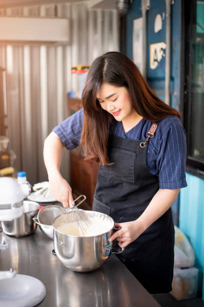 istock Beautiful woman is making bakery 1206270804