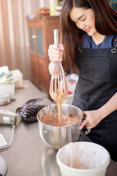 istock Beautiful woman is making bakery 1206270805