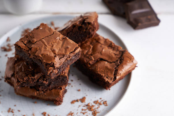 istock Pieces of brownie cake served on a white table Chocolate cake 1206271375