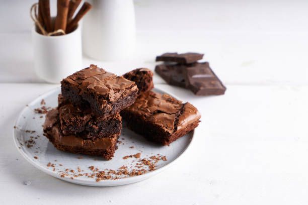 istock Pieces of brownie cake served on a white table Chocolate cake 1206271376