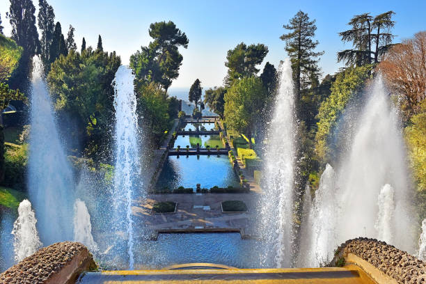 park and fountains, Villa d'Este in Tivoli, Italy fountain of Neptune and fishpond in italian renaissance garden - villa d'Este in Tivoli, Italy neptune roman god stock pictures, royalty-free photos & images
