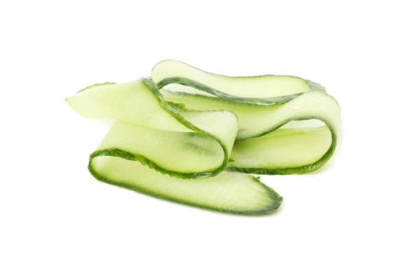 istock Fresh cucumber curls isolated on white background 1206273627