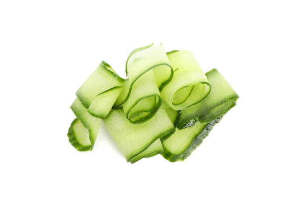 istock Green cucumber slices isolated on white background 1206274488