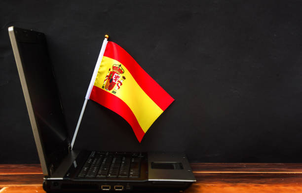 istock flag of Spain and laptop 1206274969
