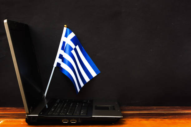 istock flag of Greece and laptop 1206274979