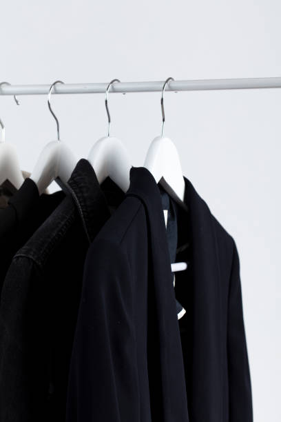 istock Women's clothes on coat hangers isolated in white background 1206275160
