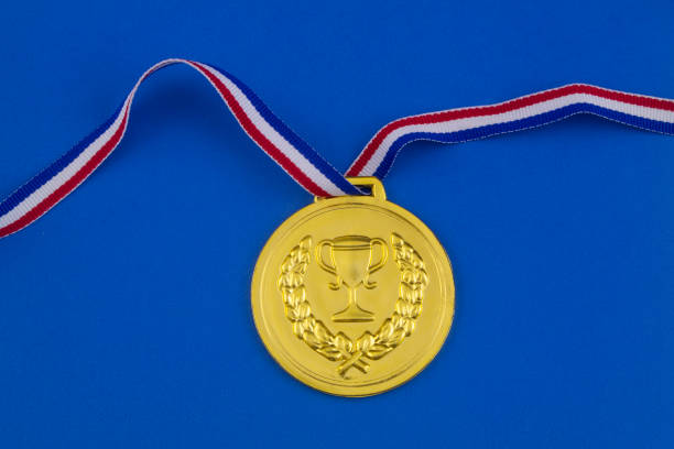 istock Gold medal on blue background 1206275872