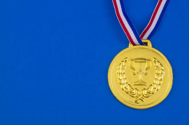 istock Gold medal on blue background wit copy space 1206275918