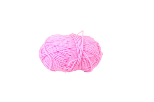 istock Skein of woolen threads of pink color, isolate. 1206276490