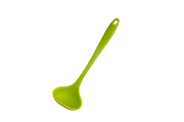 istock Single silicone green small plastic ladle close up shot isolated on pure white 1206278231
