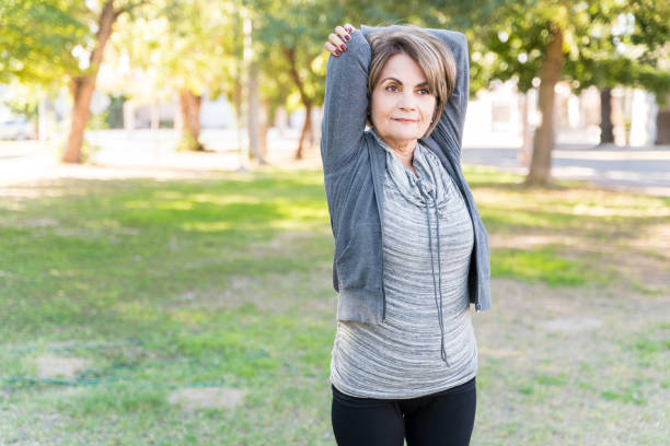 istock Active Senior Woman Exercising With Arms Raised 1206282314