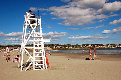 Newport, RI, USA August 17 2007 A lifeguard watches over a small crowd at Easton Beach in Newport Rhode Island