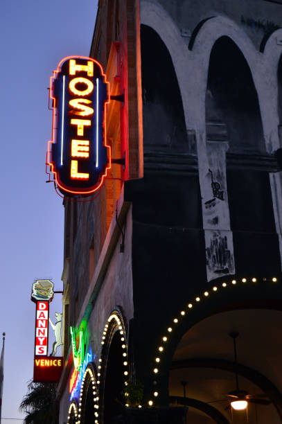 A youth hostel in Venice Beach, California Venice Beach, CA, USA July 23, 2014 The lights of a hostel glow in the twilight of Venice beach, California hostel photos stock pictures, royalty-free photos & images