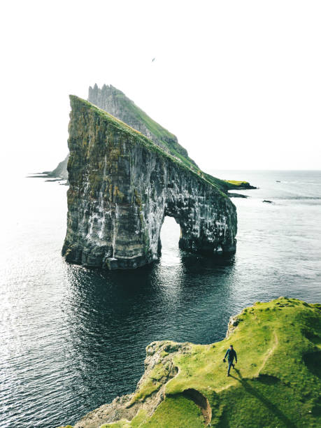 istock man with arm raisd camping at the faroe islands 1206286117