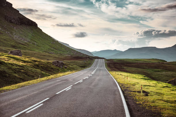istock winding road at faroe islands 1206289093