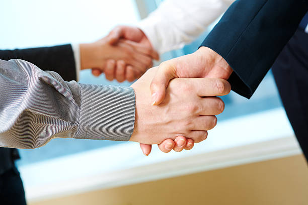 istock Pair of handshakes 120629362