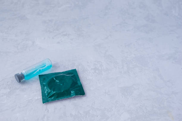 istock a condom and exciting on a grey background 1206294398