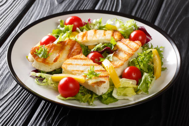 istock Crispy grilled halloumi with fresh vegetables close-up on the plate. Mediterranean style. horizontal 1206294557