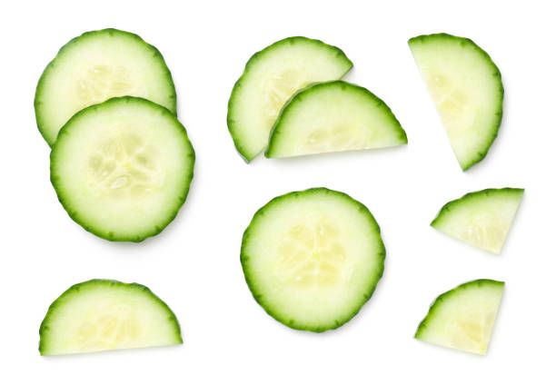 istock Fresh Cucumber Slices Isolated On White Background 1206303095