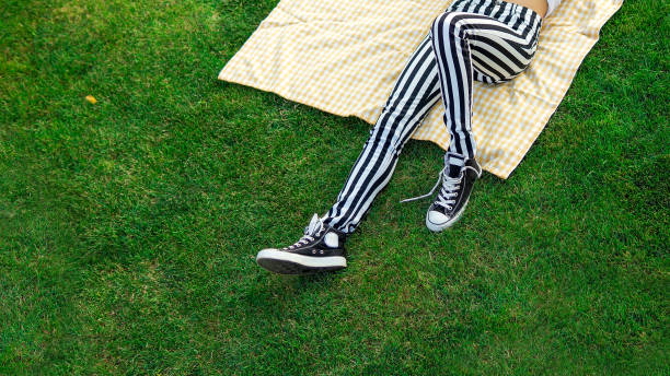 istock relaxing on the grass in a park 1206304865