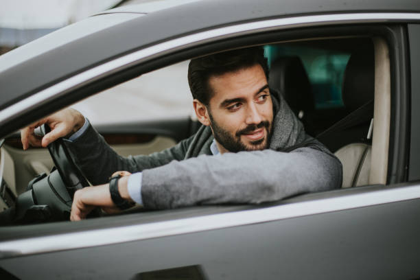 istock Business man is driving car 1206304882