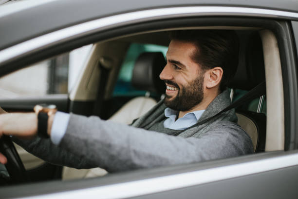 istock Business man is driving car 1206304947