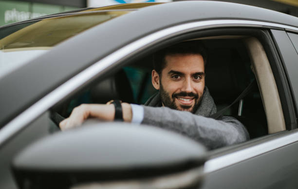 istock Business man is driving car 1206305186