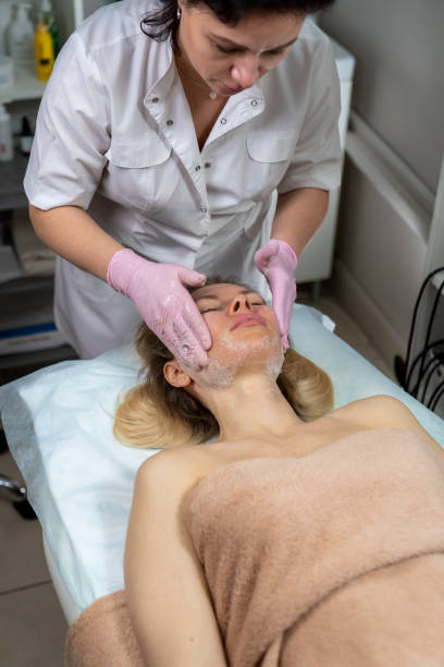 istock beautician makes procedure for a girl with problem skin 1206306089