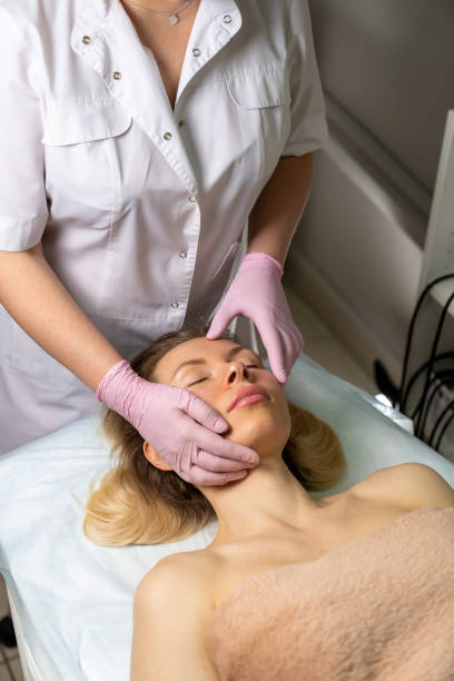 istock beautician makes procedure for a girl with problem skin 1206306414