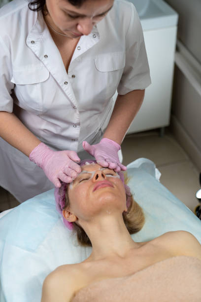 istock beautician makes procedure for a girl with problem skin 1206307163