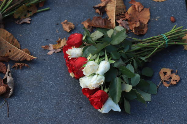 istock Funeral flowers on a tomb 1206307478