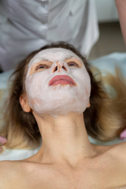 istock beautician makes procedure for a girl with problem skin 1206308850