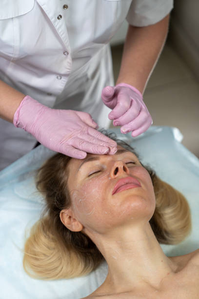 istock beautician makes procedure for a girl with problem skin 1206309158