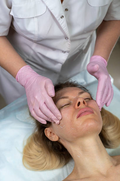 istock beautician makes procedure for a girl with problem skin 1206309257
