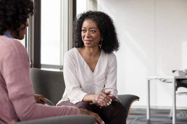 istock Caring African American female therapist talks with patient 1206311510