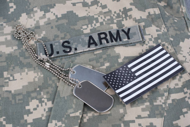 istock US flag patch with dog tag on Army Combat Uniform 1206314360