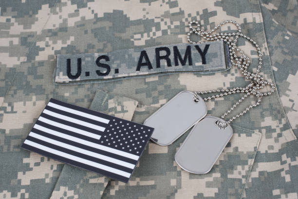 istock US flag patch with dog tag on Army Combat Uniform 1206314379