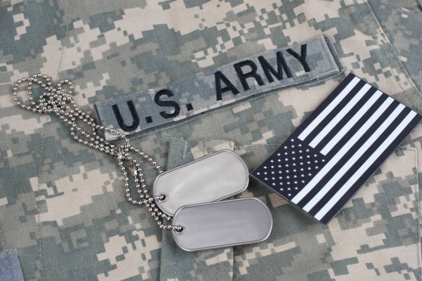 istock US flag patch with dog tag on Army Combat Uniform 1206314443